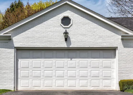 Professional technician performing garage door repair in Gahanna, Ohio for a residential property.