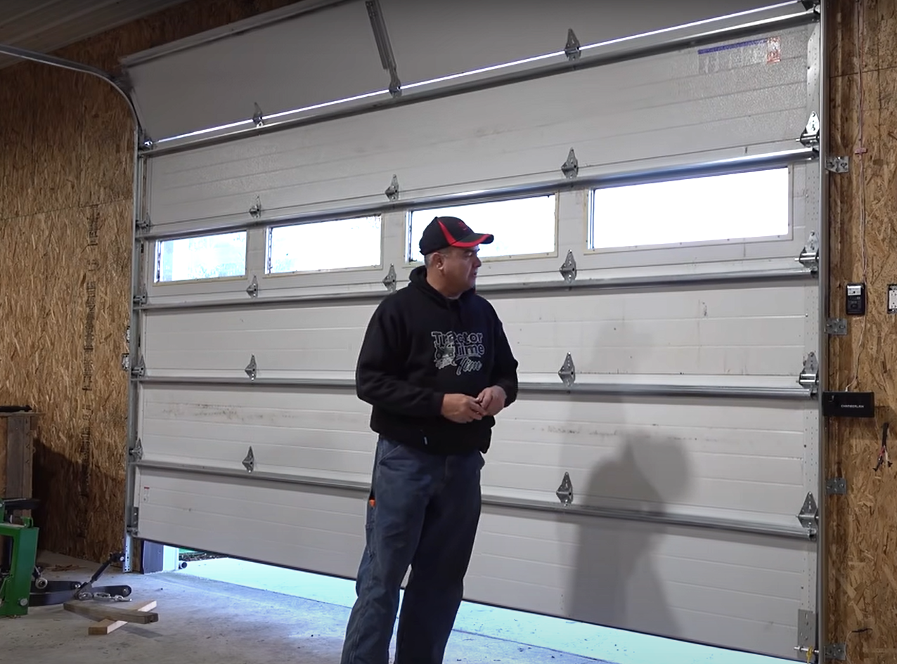 Technician repairing a residential garage door in Gahanna, Ohio, for local garage door repair services.