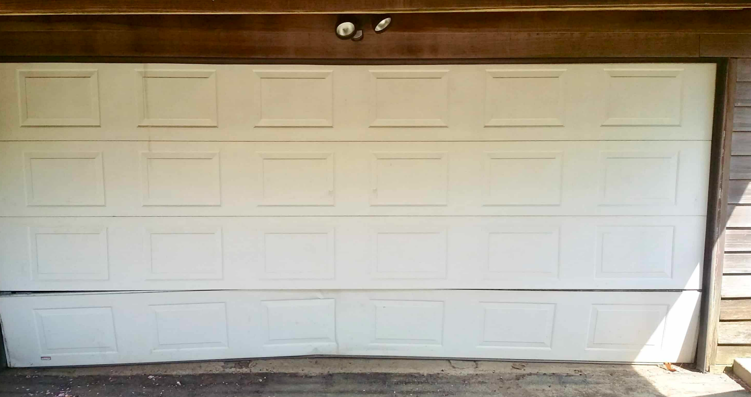 Professional technician installing a new garage door during a garage door replacement service at a residential home in Gahanna, Ohio.