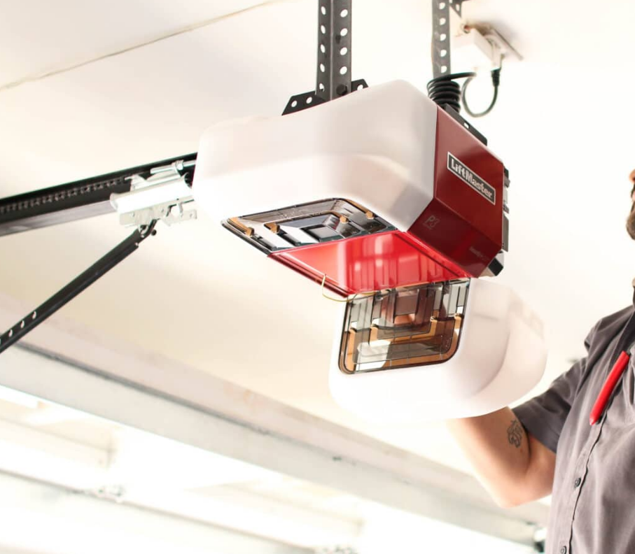 A technician repairing a garage door opener in a Gahanna, Ohio residential garage, highlighting professional garage door opener repair services.