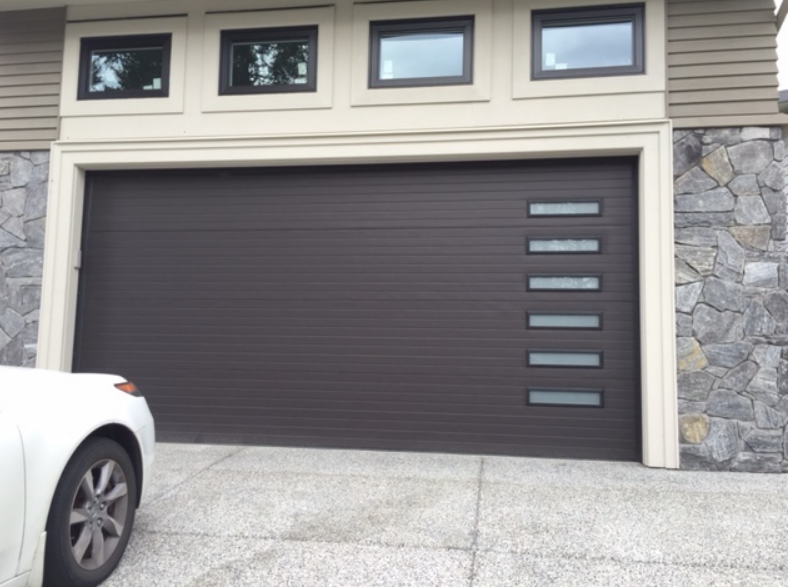 A custom garage door installed on a residential home in Gahanna, Ohio, showcasing a modern design and professional garage door repair craftsmanship.