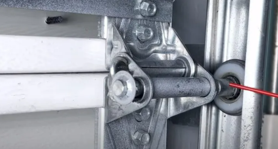 Noisy garage door fix in Gahanna, Ohio – technician repairing a loud garage door mechanism in a residential garage