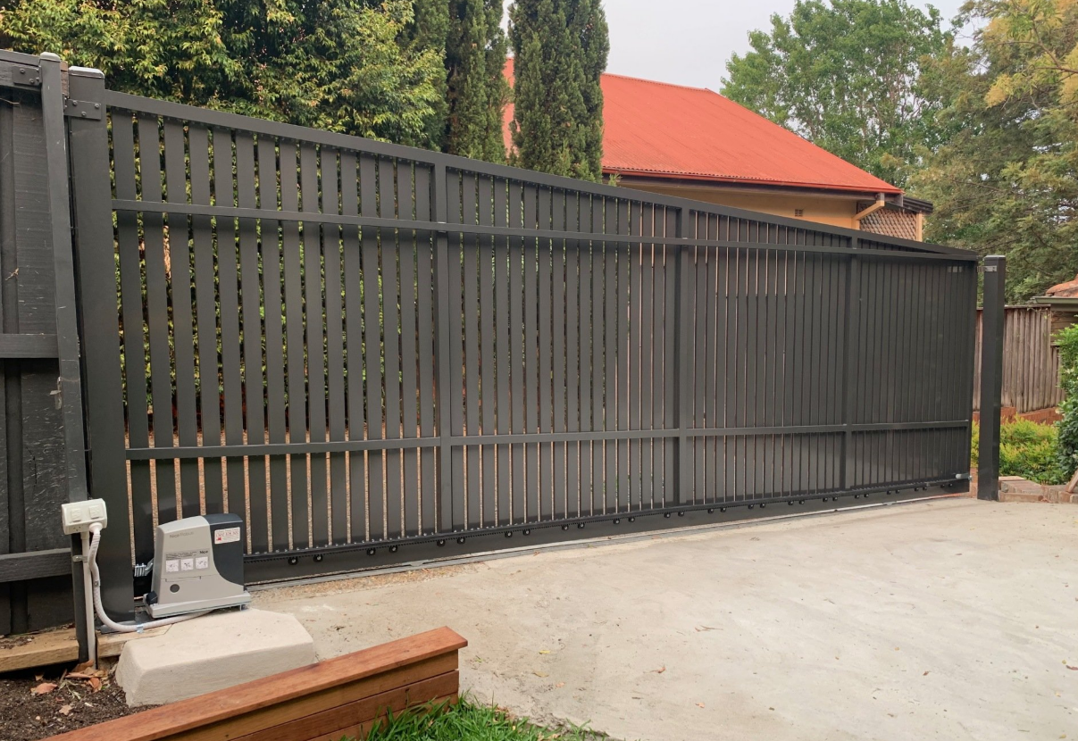 A professional technician performing residential gate repair on a residential property in Gahanna, Ohio, with tools and equipment visible, optimizing for garage door and gate repair services.