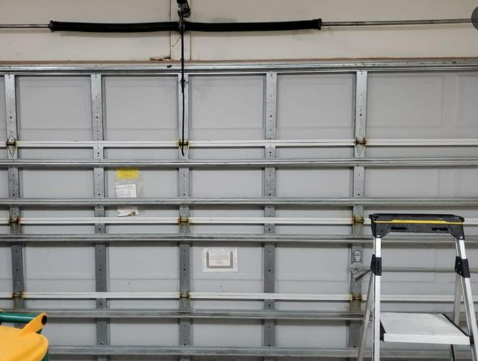 Professional technicians performing garage door repair in Gahanna, Ohio, showcasing efficient and reliable service solutions