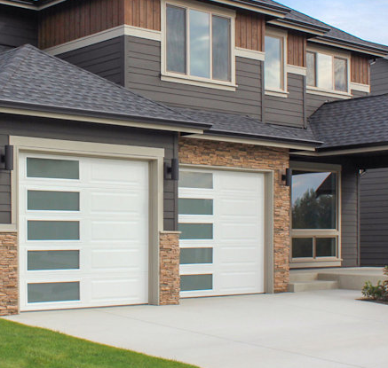 An experienced technician from Garage Door Repair Gahanna Ohio LLC expertly repairing a residential garage door, ensuring optimal function and safety.
